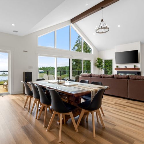 Gather around the dining table while enjoying panoramic views of Hay Bay.