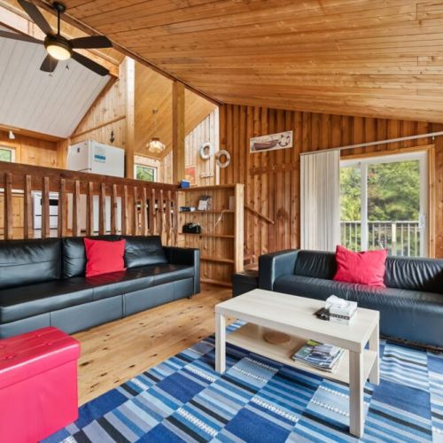 Comfortable living room with cozy seating and a relaxed cottage atmosphere.