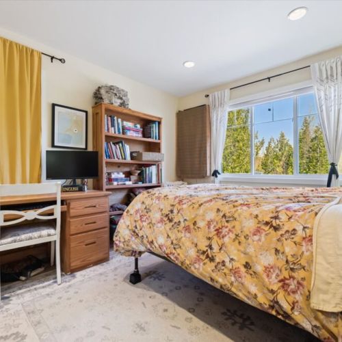 This comfortable bedroom also includes a dedicated workspace, making it easy to catch up on work or plan your next adventure.