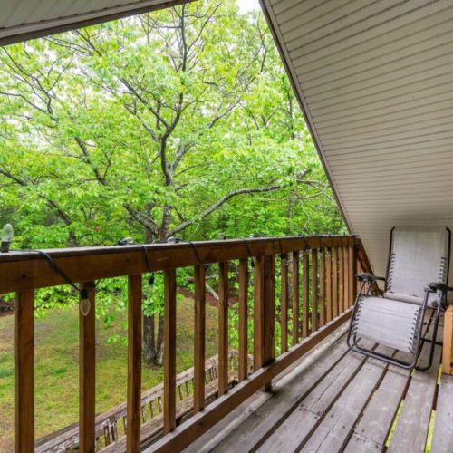 Enjoy the view of the surrounding property from the upstairs balcony.