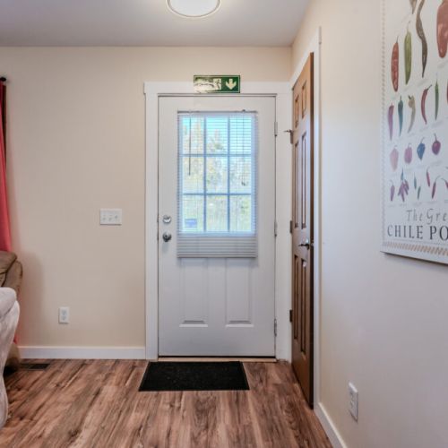Step into the inviting and bright interior of Maple Cottage, with natural light streaming in from the windows and comfortable living spaces.
