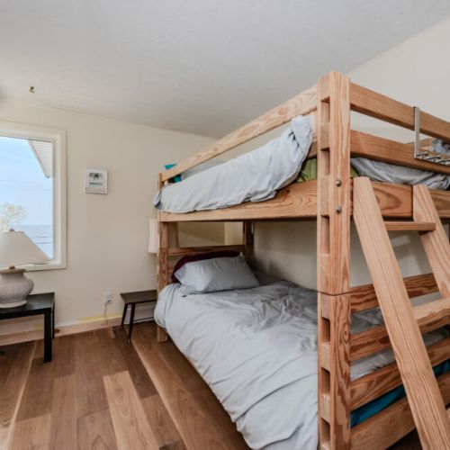 Enjoy the spacious and airy feel of the second bunk bedroom, perfect for a restful night's sleep before a full day of adventures.