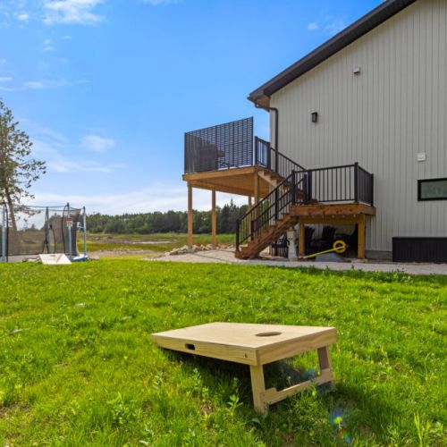 Enjoy outdoor games with cornhole and plenty of space for the whole family.