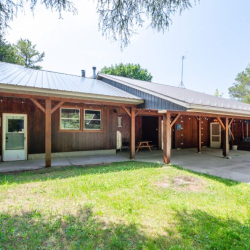 The large front veranda provides refuge from the afternoon sun.