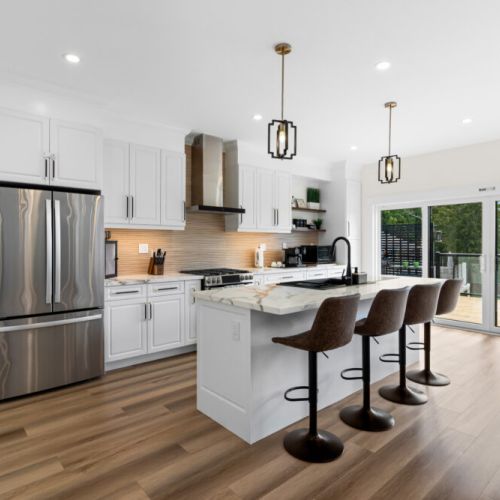 The fully equipped kitchen features a spacious island that's perfect for cooking, dining, and gathering.