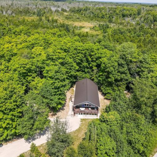 A view from above. The Chalet is fully engulfed in trees and privacy.