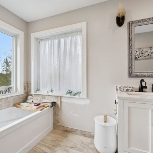 The master suite bathroom includes a simple, easy-to-use towel warmer—perfect for keeping towels cozy for the kids after a long day at the beach and bath time.