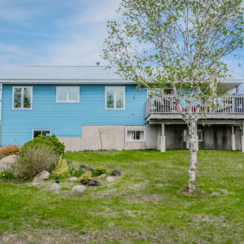Spacious yard surrounded by nature, perfect for enjoying the fresh air and sunshine of the Bruce Peninsula.