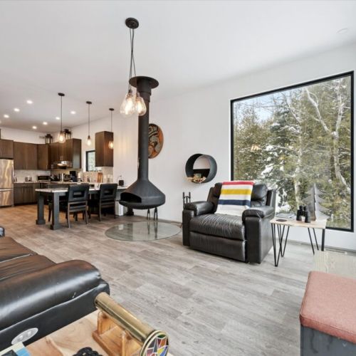 The heart of the home flows effortlessly between kitchen, dining, and living areas, making it easy to cook, snack, and spend time together.