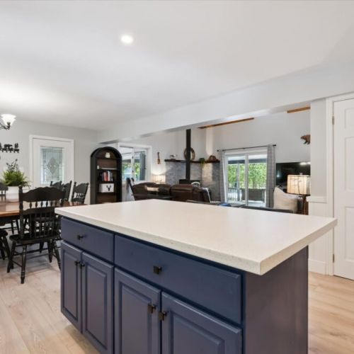 Open dining and kitchen area designed for gathering, entertaining, and enjoying cottage meals with family and friends.