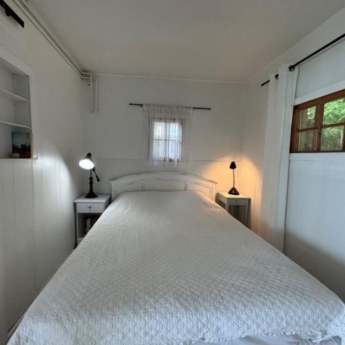 Comfortable queen bed with soft linens and calming décor.