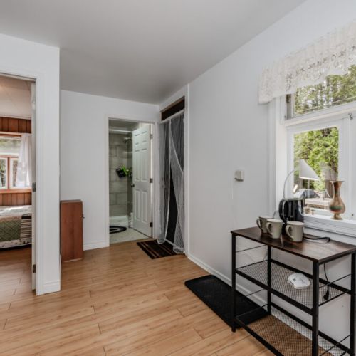 Bright and welcoming, this cozy space features a private bedroom, modern bathroom, and coffee station—perfect for a relaxing countryside escape or a peaceful weekend getaway.