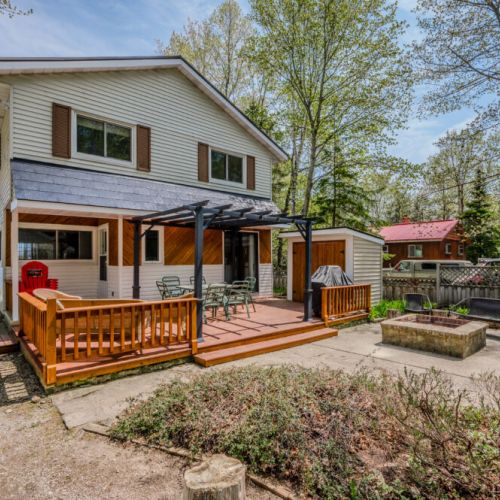 The patio and fire pit area provide a wonderful setting for outdoor fun and relaxation.