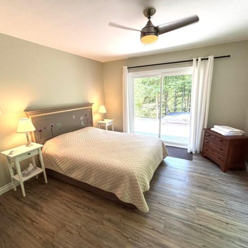 From bed to bubbles—this bedroom offers direct access to the hot tub for the ultimate unwind.