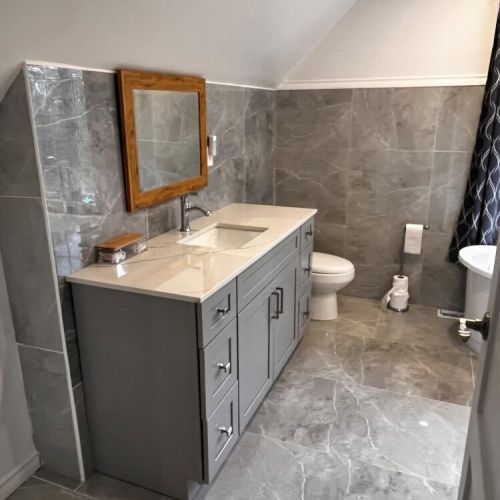 Spacious bathroom with double vanity and modern finishes for added comfort