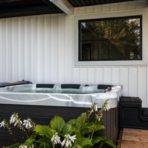 Slip into the hot tub any time of year and relax in your own sheltered outdoor oasis.