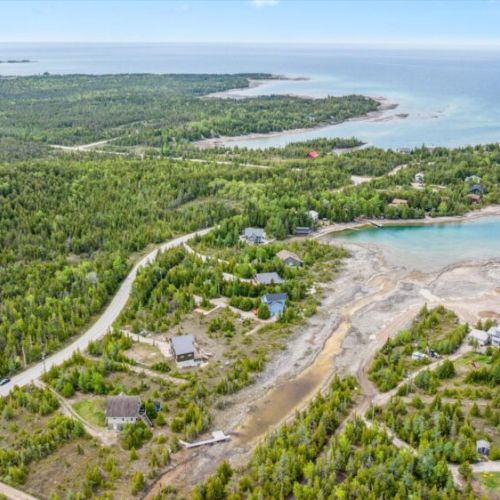 Capture the beauty of the natural inlet and rocky shore that stretches from the cottage to Lake Huron’s sparkling blue edge.