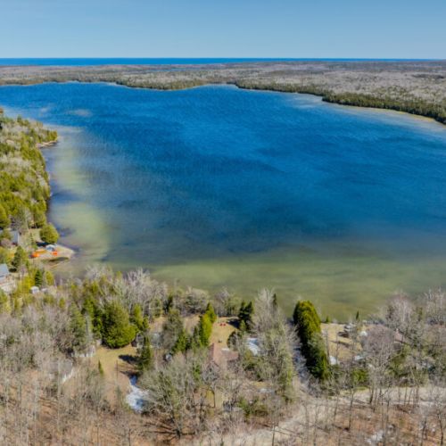 Breathtaking aerial lake views showcasing the stunning, clear waters and peaceful natural surroundings of this ultimate waterfront getaway.