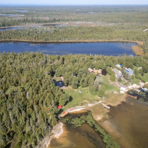 Another bird’s eye look at the property and shoreline giving you tons of space and privacy.