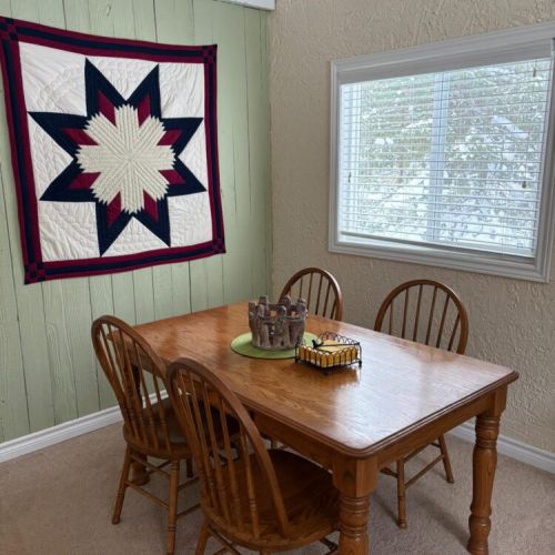 Dining table perfect for family meals, card games, and morning coffee.