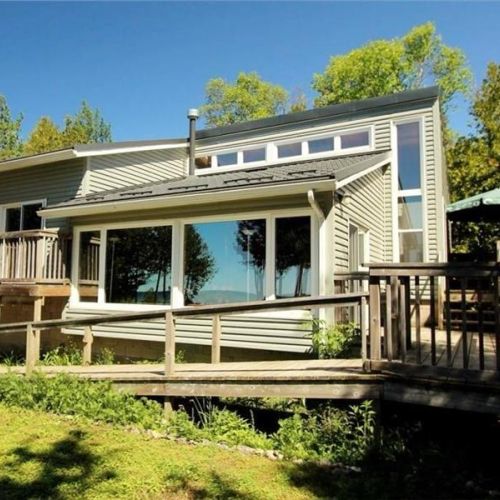 Bright, modern cottage with a large wraparound deck—perfect for relaxing and taking in the lake views.