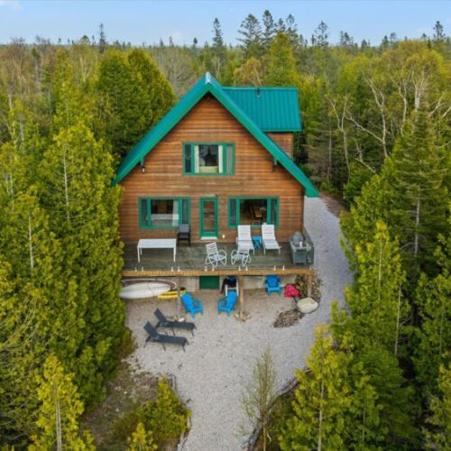Tucked among the trees, Paradise Pines offers privacy, space, and stunning waterfront scenery.