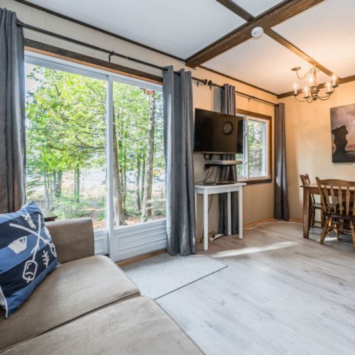 The family room is spacious and comfortable, offering great views out of the sliding doors.