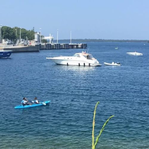 Step outside and dive into summer fun! Whether you're paddling a kayak or cruising the bay, our cottage offers immediate access to pristine blue waters. With the marina just steps away, you can bring your own boat or enjoy a local tour.