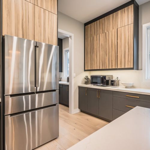 Enjoy culinary bliss in the modern kitchen featuring top-notch appliances, sleek countertops, and a generously sized kitchen island – perfect for preparing delicious meals and entertaining guests.