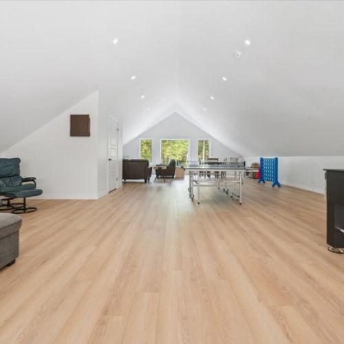 A bright upper level designed for play, relaxation, and family time, with plenty of room to spread out.