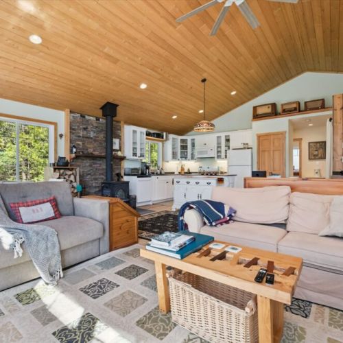 Gather with family and friends in the heart of the cottage, where the kitchen, dining, and living areas create the perfect space to connect.