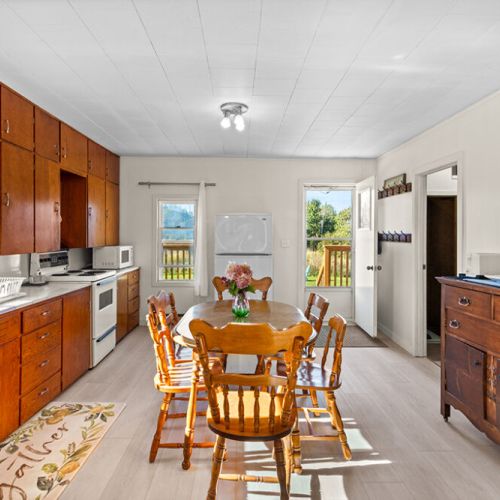 A bright and welcoming dining space with easy access to the kitchen, living area and outdoor deck.