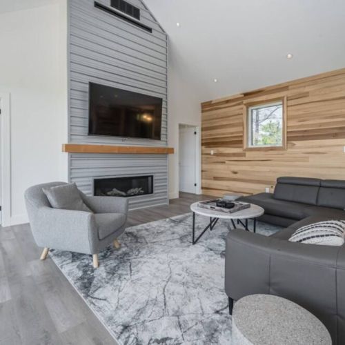 The rare birch covered walls provide a modern yet cottage-like feel to the Great room.