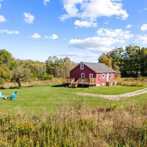 Smith Homestead offers a private rural setting with a spacious lawn, new deck and plenty of room to relax outdoors.