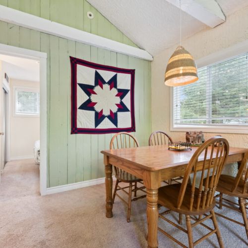 Dining table perfect for family meals, card games, and morning coffee.