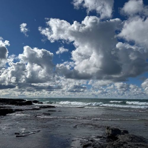 Breathtaking waterfront views with dramatic skies and rugged shorelines—ideal for nature walks, photography, and peaceful moments by the lake.