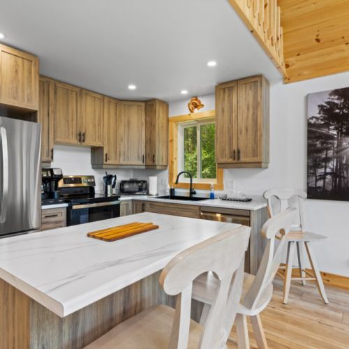 Gather around the large kitchen island for meals, morning coffee, or planning your next adventure.