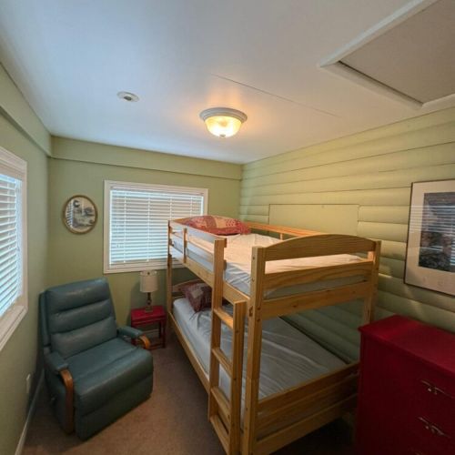 Cozy bunk room with extra sleeping space, perfect for kids or additional guests.
