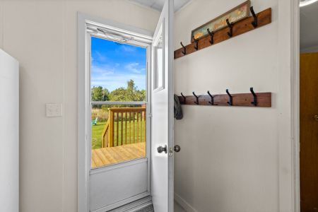 Step directly outside to the deck and spacious yard, perfect for enjoying the fresh country air.