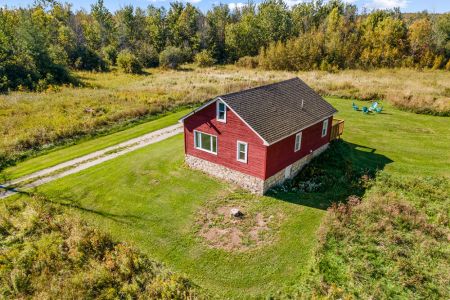 From above, Smith Homestead feels wonderfully secluded among the fields, forest and open countryside.