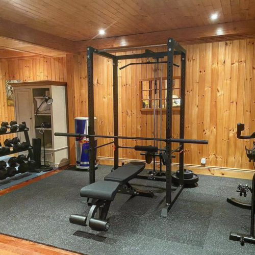 Stay active during your stay with this well-equipped home gym, featuring a range of weights and workout equipment to keep you in shape.
