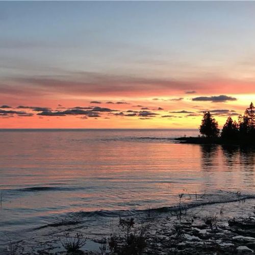 Stunning Lake Huron sunsets—unwind as the sky lights up over the water.
