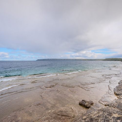Wake up to stunning waterfront views of Isthmus Bay. The crystal-clear waters and rocky shoreline create a tranquil setting, perfect for enjoying nature after exploring the nearby Bruce Trail or Lion’s Head Lookout.