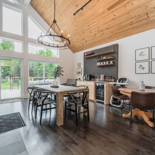 The stunning dining room provides a stunning example of contemporary living, including a coffee bar, games table, lounger and fireplace for those cooler evenings.