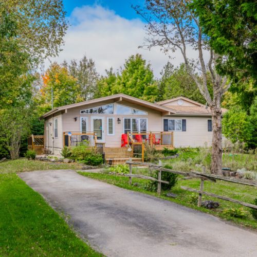 Welcome to Blue Horizon, where a peaceful setting and natural beauty await. Relax on the spacious front deck, perfect for enjoying the serene surroundings.