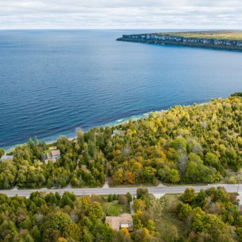 Enjoy breathtaking views of the nearby lake, with the tranquil water stretching as far as the eye can see, perfect for peaceful reflection or exploration.