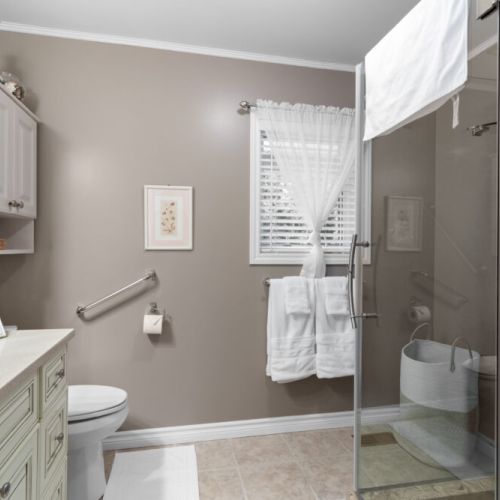 A spacious full bathroom with a glass-enclosed shower provides a comfortable place to refresh after a day of exploring.