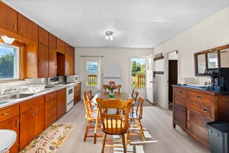 A bright and welcoming dining space with easy access to the kitchen, living area and outdoor deck.