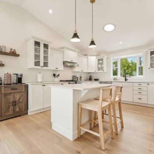 Bright, modern kitchen with a large island, top appliances, and plenty of space to cook and connect during your stay.