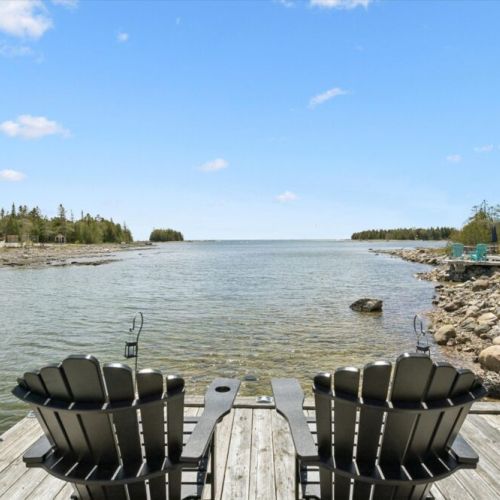 Relax by the water’s edge with stunning views of Bradley Harbour from the private dock seating area.